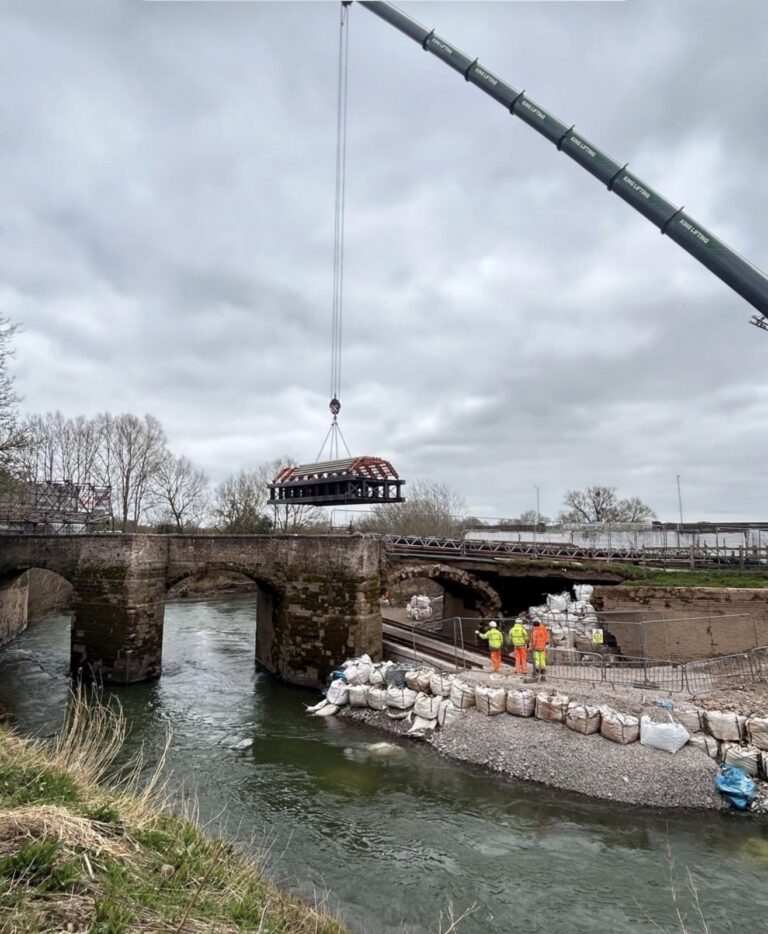 Crane clearing rubble from Powick Old Bridge