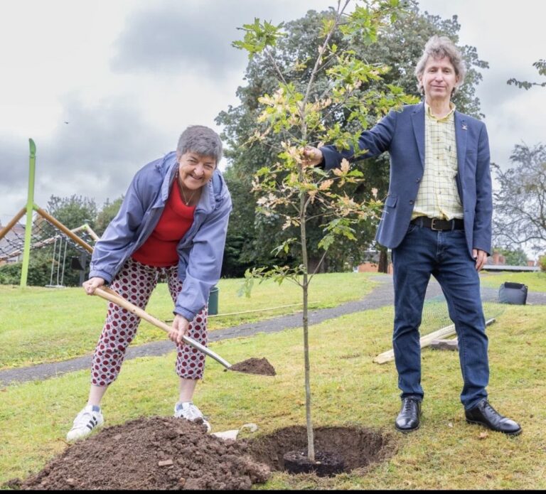 Clir Lynn Denham, Leader of Worcester City Council, and Daniel Daniels, Chair of the Battle of Worcester Society, planting the oak tree in Fort Royal Park.