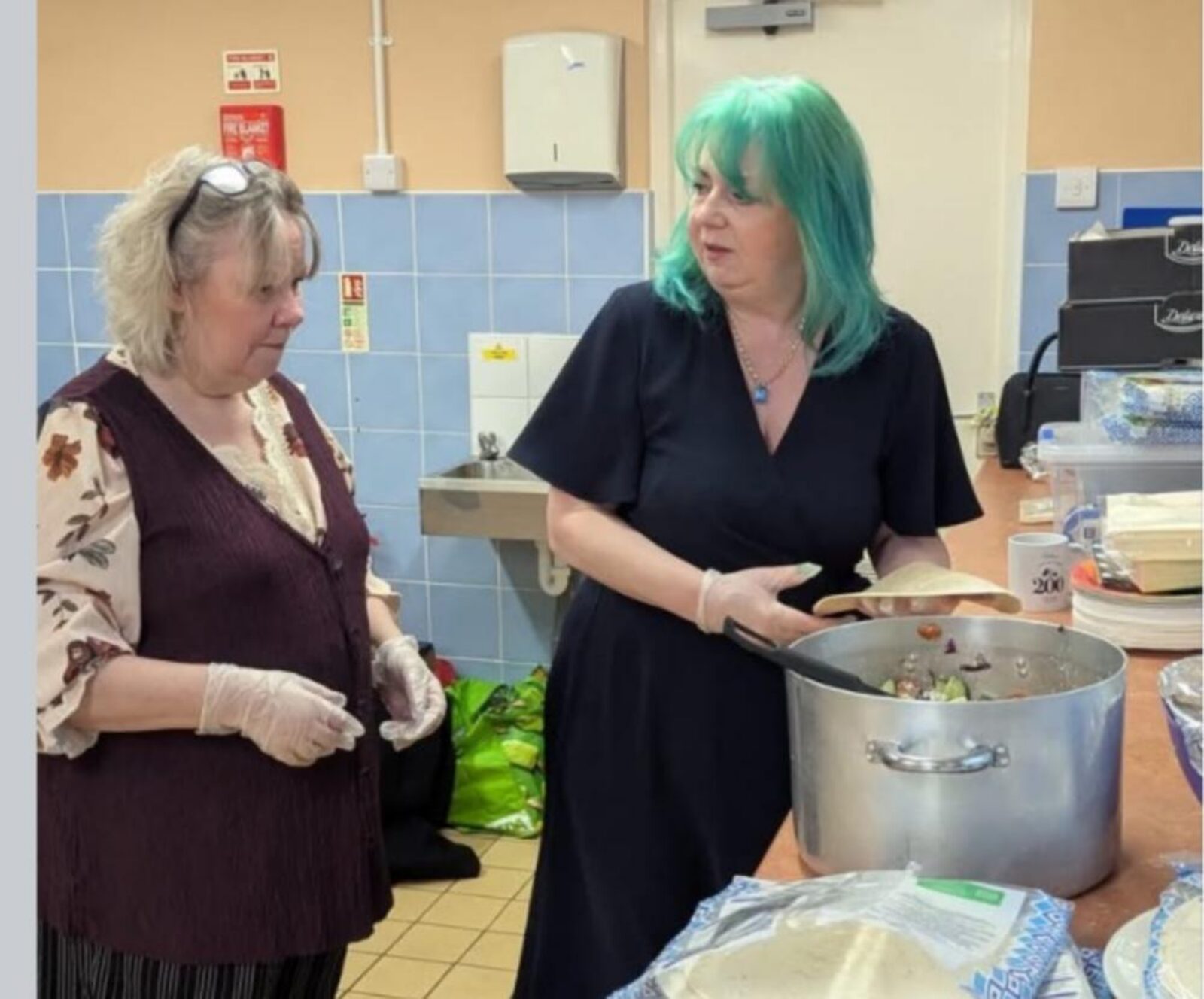 Councillor Jill Desayrah preparing food at the Open Door Café at Warndon Hub