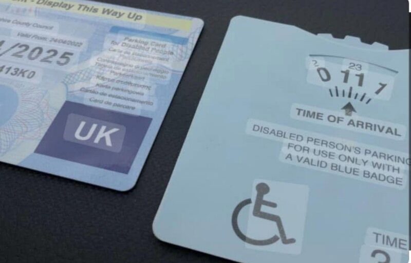 Blue badge and parking clock showing support for a resident’s successful application