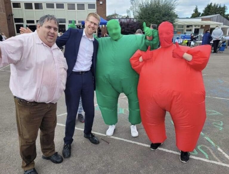 Tom Collins MP and Cllr Richard Udall with a red and green man